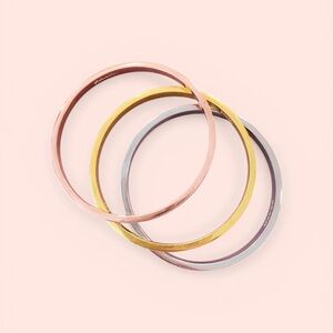 COACH / Elegant Gold, Silver, and Rose Gold Bangle Set